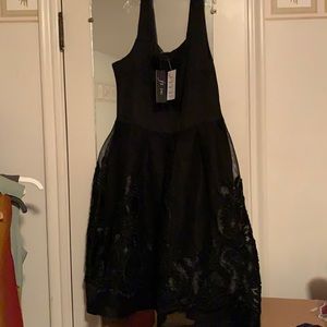 Black boutique dress, size L, 100% polyester, machine washable